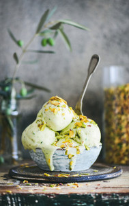 Bowl of pistachio ice cream on kitchen counter  close up