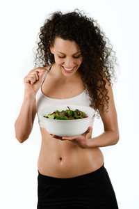 Beautiful young mixed woman with salad  isolated on white