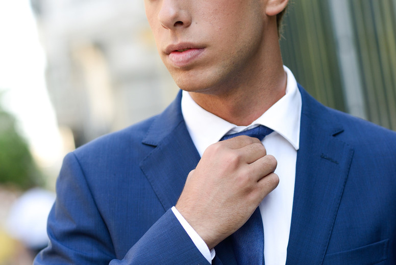 Attractive young businessman in urban background