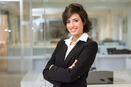 Business woman in an office  Crossed arms