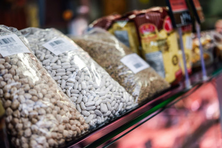 Bags of dried legumes for sale in a store
