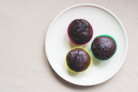 Three chocolate muffins