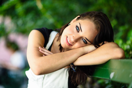 Happy young woman with blue eyes looking at camera