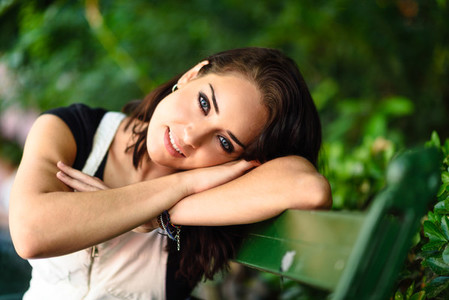 Happy young woman with blue eyes looking at camera