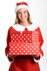 Blonde woman in Santa Claus clothes smiling with gift boxes