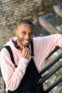 Smiling black man wearing casual clothes outdoors