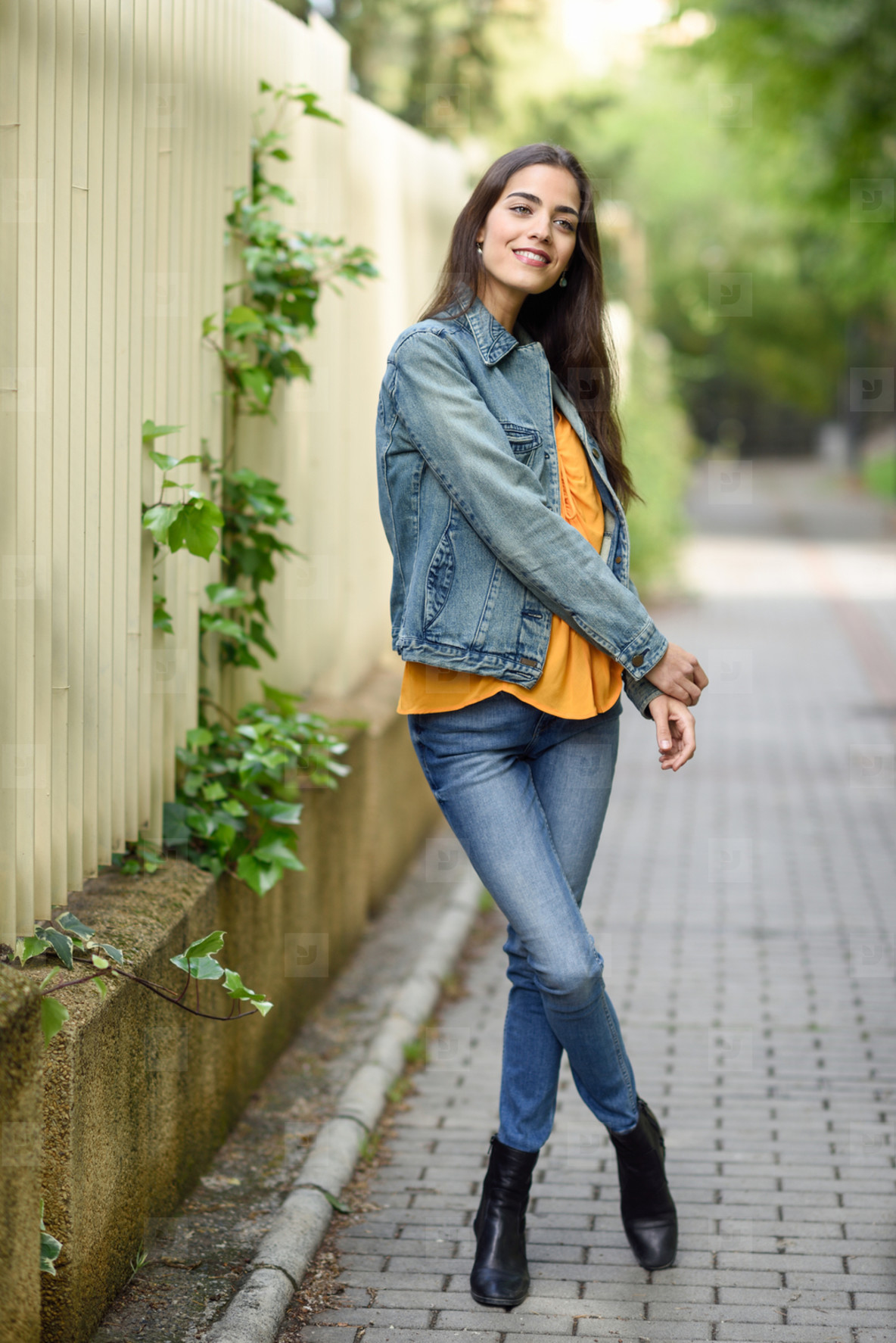 Woman with nice hair wearing casual clothes in urban background stock photo  (184944) - YouWorkForThem