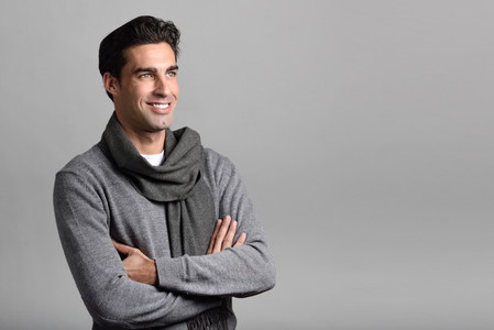 Handsome man wearing winter clothes on white background