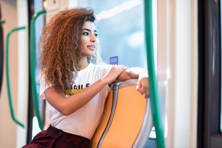 Arabic woman inside subway train  Arab girl in casual clothes