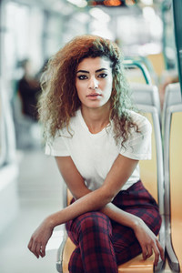 Arab woman inside metro train  Arab girl in casual clothes