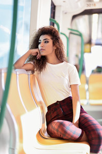 Arab woman inside metro train Arab girl in casual clothes