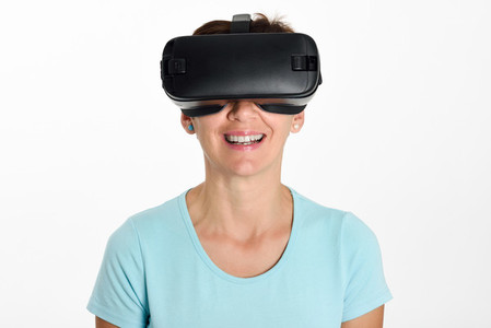 Woman looking in VR glasses and gesturing with his hands