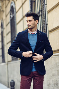 Attractive man wearing british elegant suit in the street Moder