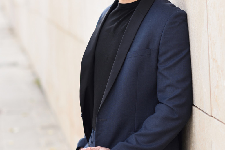 Attractive young businessman in urban background