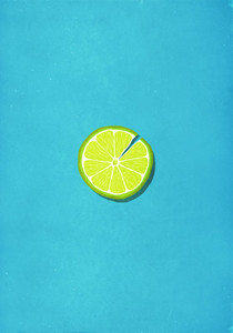 Cracked lime slice against blue background