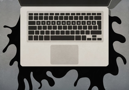 Cybermobbing text on laptop keyboard