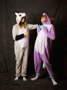 Playful girls in animal costume pajamas
