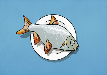 Whole dead fish on dinner plate