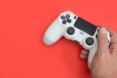 Video games man playing white gaming controller in hands isolate