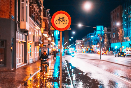 Bicycle lane sign on a night street