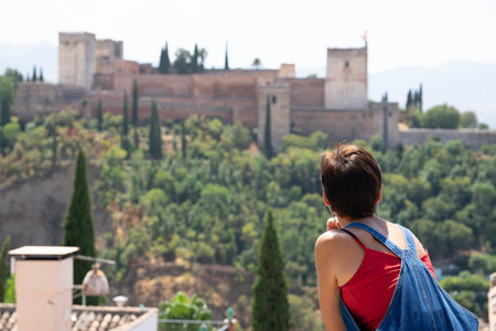 Rear view of woman looking at the Alhambra of Granada