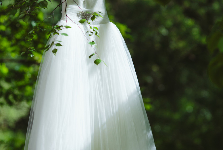 Wedding dress hanging on a tree