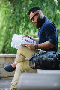bearded man looking at a map