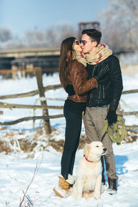 Young couple posing in winter park