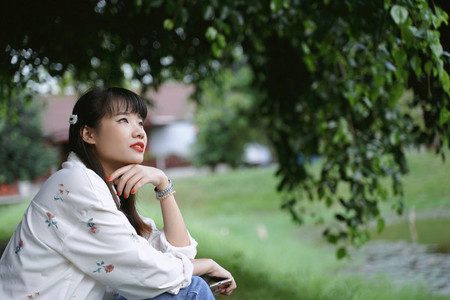 Young asian attractive woman in casual outfit thinking and relax