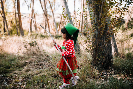 Children disguised to christmas in the forest with their family