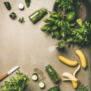 Ingredients for making green smoothie over concrete background  square crop