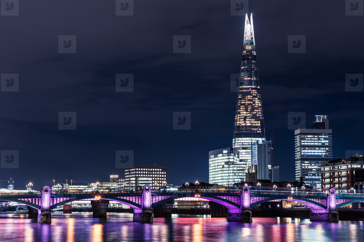 Modern London skyline night stock photo (191217) - YouWorkForThem