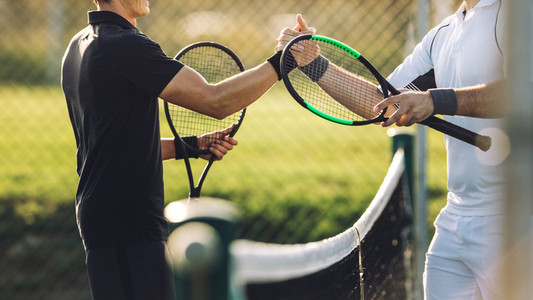 Tennis players shaking hands after the match