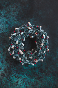 Beautiful Christmas wreath on a blue textured background  Top view  flat lay  copy space