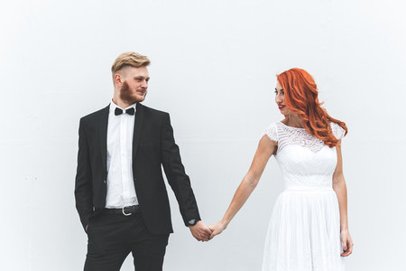 Wedding couple on a background of whitewall