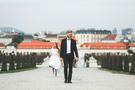 Wedding couple on a walk in the estate of the Belvedere in Vienn