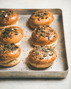 Freshly baked homemade buns with seeds for cooking burgers