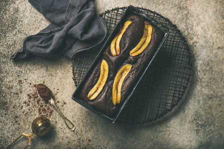 Chocolate banana bread cake with cinnamon in baking tin