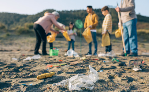 Plastics in the beach with group of volunteers
