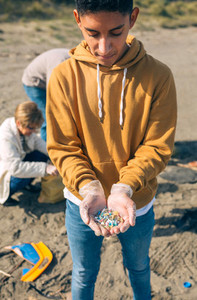 Young man showing microplastics
