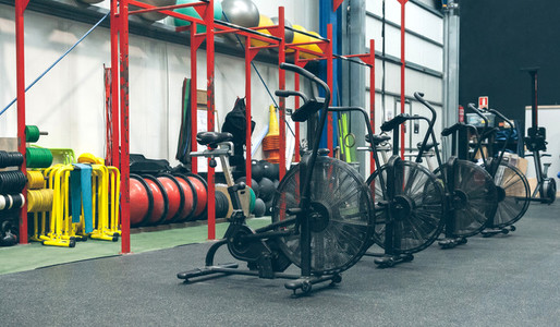 Gym with air bikes and sports equipment