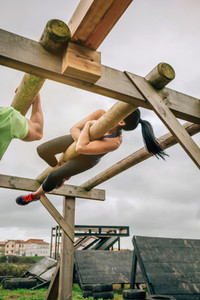 Participant in a obstacle course doing weaver