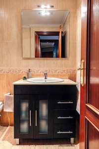 Bathroom with washbasin cabinet and mirror