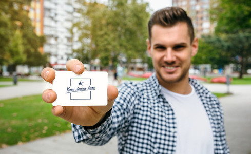 Man showing card with customizable design