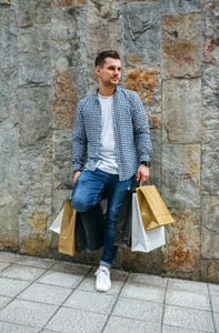 Young man with shopping bags