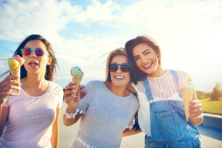 Three girlfriends enjoying a summer treat