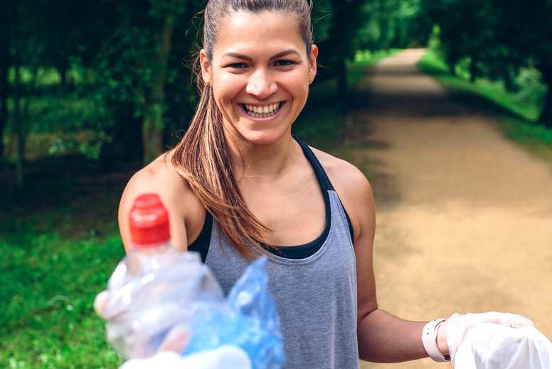 Girl showing garbage she has collected