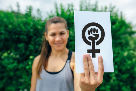 Woman showing symbol of feminism