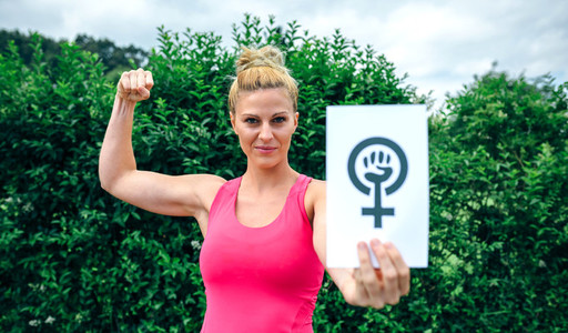 Woman showing symbol of feminism