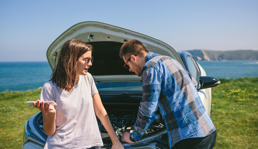 Couple argue while fix their broken down car